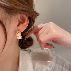 Elegant French vintage C-shaped hoop earrings with red tulip enamel pattern