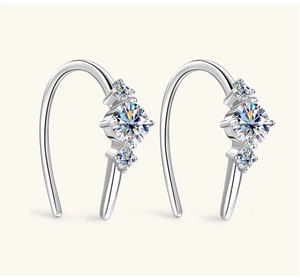 Detail of silver S925 drop earrings with three brilliant-cut moissanite stones