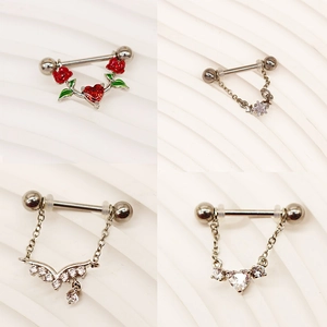 Detailed set of silver nipple rings with red rose, heart charms, and star chain pendants