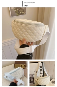 Detail of cream quilted children's waist bag with adjustable strap and zip closure