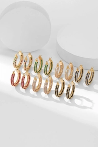 Detailed close-up of micro-pave multicolored zircon hoop earrings in various vibrant colors