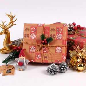 Christmas gift wrapping paper with red plaid patterns, pine needles, and vintage labels