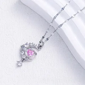 Pink heart moon pendant necklace with silver plating and white cubic zirconia accents