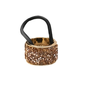 Elegant gold ponytail holder with sparkling brown rhinestones on black elastic band