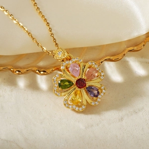 Elegant gold flower necklace with colorful pear-cut gemstones and sparkling crystal accents