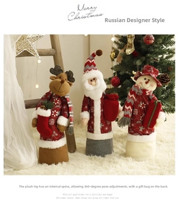 Close-up of Christmas plush dolls with adjustable spine for 360-degree posing and gift bags