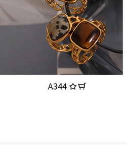Macro shot of retro gold chain ring featuring a square-cut tiger eye stone detail