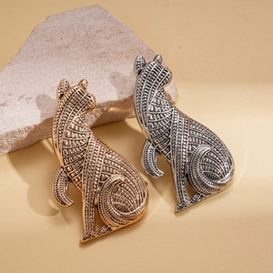 Vintage textured metal cat brooches in gold and antique silver finish with detailed patterns