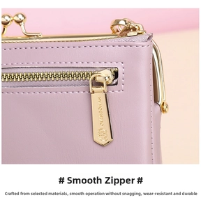 Close-up of smooth light gold zipper and brand engraving on lavender leather bag