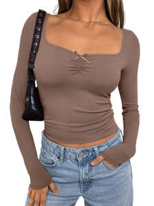 Close-up of brown long sleeve top with bow detail and flattering square neckline