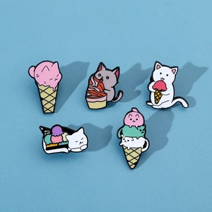 Set of five cute cartoon cat ice cream enamel pins on light blue background