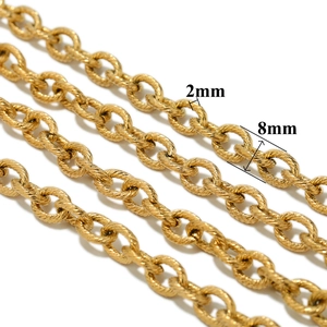 Macro detail of 8mm golden stainless steel twist chain showing the 2mm wire thickness