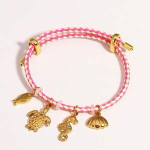 Adjustable woven bracelet featuring gold fish, turtle, seahorse, and shell charms