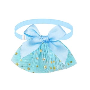 Detail of light blue pet bow tie with gold star mesh pattern and silky ribbon finish