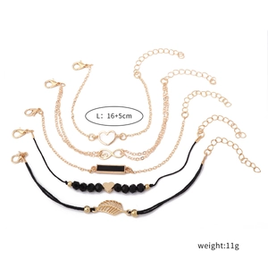 Detailed view of 5pcs set handmade bracelets with heart, leaf and infinity charm details