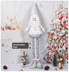 Detail of silver Christmas gnome with stretchable legs in a festive holiday setting
