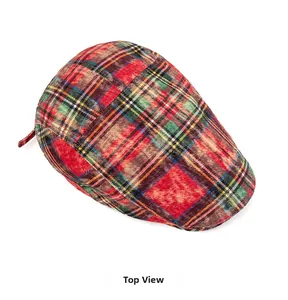 Top view of classic plaid flat cap with red and green checkered patterns and vintage style