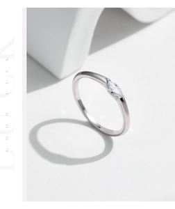 Detail shot of a minimalist s925 silver ring featuring a sparkling marquise-cut gemstone