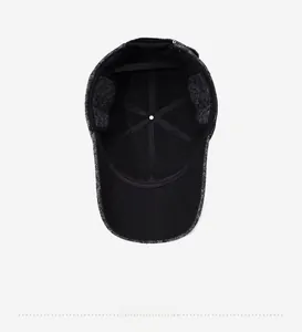 Detail of warm winter baseball cap featuring thick wool lining and foldable ear flaps