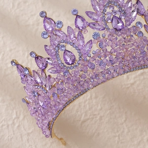 Luxury gold bridal crown with purple crystals and sparkling rhinestones for gala events