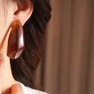 Vintage irregular amber resin earrings for women with a luxury geometric design