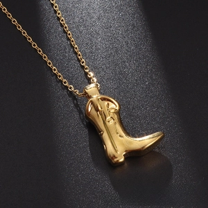 Detailed view of a gold-plated cowboy boot pendant with a delicate polished cable chain