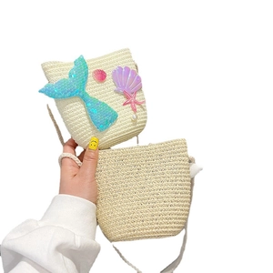 Straw mermaid tail crossbody bag with sequins and shells for girls on white background