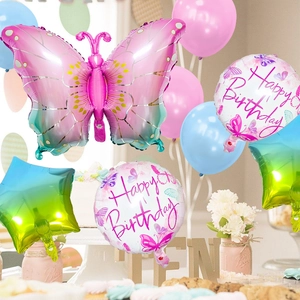 Detail of pink butterfly and star foil balloons with Happy Birthday party decor set