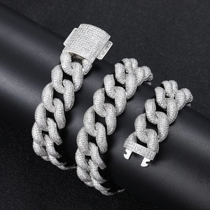 Close-up of 18mm silver Cuban link bracelets with cubic zirconia and security clasp