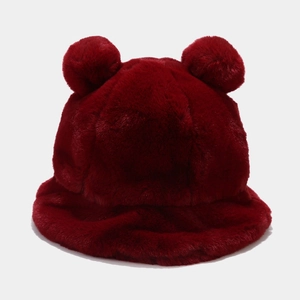 Detailed texture of dark red plush bucket hat with fluffy faux fur and cute bear ears