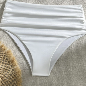 Detailed view of white high-waisted bikini bottoms with elegant side ruched fabric details