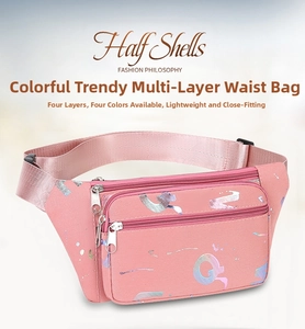 Detail of pink oxford fanny pack showing four functional zippered pockets and colorful prints