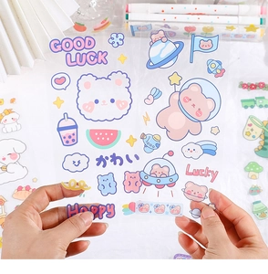 Close-up of cute transparent PET cartoon bear and astronaut stickers on a clear background