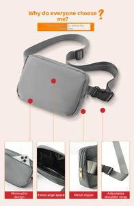 Detail view of grey nylon waist bag showing metal zippers and mesh interior compartments