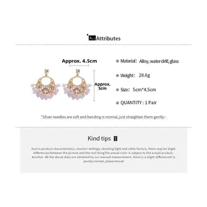 Detailed specs of purple beaded tassel earrings with crystal studs and alloy frame