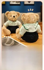 Detail of a teddy bear plush in a striped shirt shown via mirror reflection
