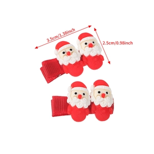 Detail showing dimensions of red Santa Claus resin hair clips on a white background