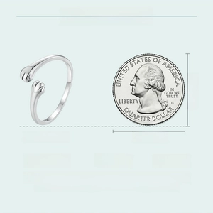 Detailed size information of s925 silver cat paw ring with coin for scale reference