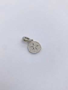 Macro shot of silver starfish charm with micro-paved zircons for DIY jewelry making