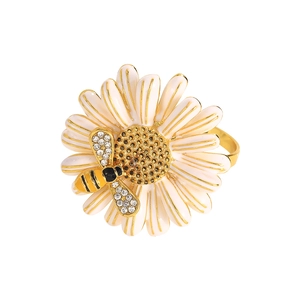 Elegant white daisy napkin ring with golden accents and a small bee with crystals