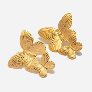 French retro style gold stainless steel double butterfly stud earrings on white background