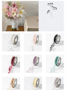 Close-up detail of floral mesh ribbon with pearl edges in multiple colors for bouquets