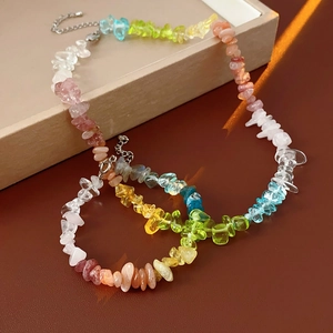 Close-up of rainbow natural stone beaded necklaces with steel clasps on a jewelry box