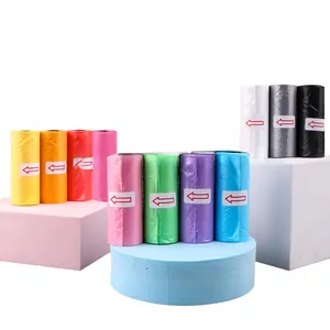 Colorful biodegradable dog poop bags displayed on decorative blocks with clear arrows