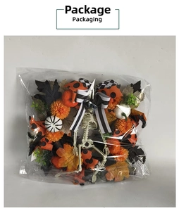 Detail view of Halloween wreath with maple leaves and pumpkins in clear packaging bag