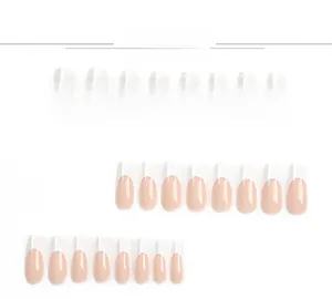 Detail view of 24 pieces French tip press-on nails in pink and white coffin shape