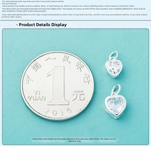 Detailed view of S925 sterling silver heart pendants with a coin for size reference