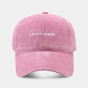 Detail of Chill Vibes embroidery on washed rose pink cotton twill baseball cap
