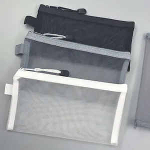 Set di 3 astucci in rete trasparente nei colori nero, grigio e bianco con cerniera