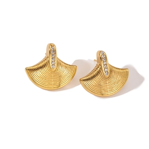 Detailed close-up of gold-plated seahorse star fan-shaped stud earrings with zircons